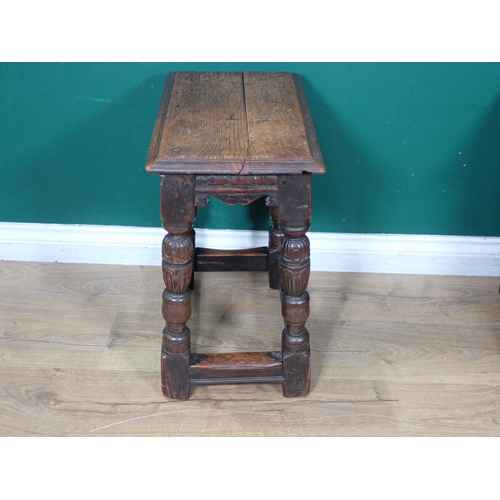 451 - An Elizabethan style oak Joint Stool with carved and shaped frieze raised on turned and carved cup a... 