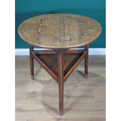 455 - An 18th Century oak and elm Cricket Table with lower tier mounted on triangular cut supports 2ft 6in... 