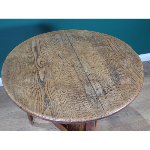 455 - An 18th Century oak and elm Cricket Table with lower tier mounted on triangular cut supports 2ft 6in... 