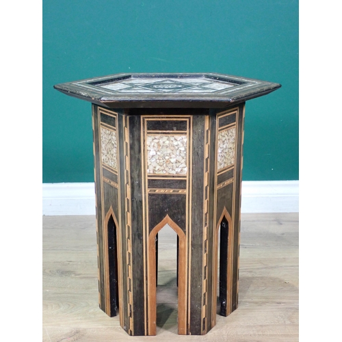 458 - A Moorish hardwood hexagonal Occasional Table, the top with star and central script motif, with all ... 