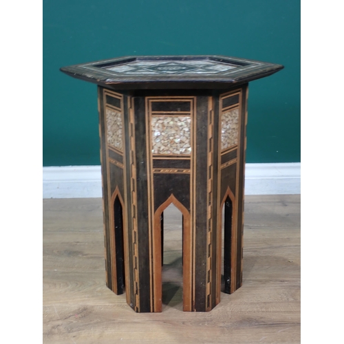 458 - A Moorish hardwood hexagonal Occasional Table, the top with star and central script motif, with all ... 