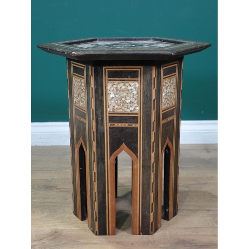 458 - A Moorish hardwood hexagonal Occasional Table, the top with star and central script motif, with all ... 