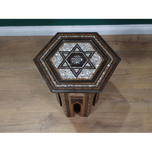 458 - A Moorish hardwood hexagonal Occasional Table, the top with star and central script motif, with all ... 