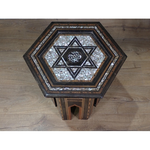 458 - A Moorish hardwood hexagonal Occasional Table, the top with star and central script motif, with all ... 