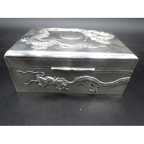 46 - A Chinese silver Cigarette Box with relief dragon design to lid and sides, 5 and 3½in, maker: Tuck C... 