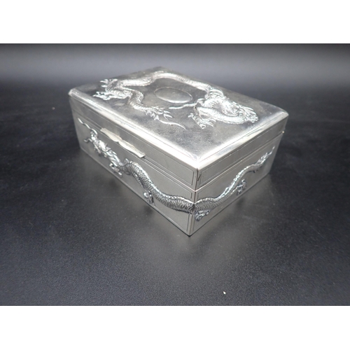 46 - A Chinese silver Cigarette Box with relief dragon design to lid and sides, 5 and 3½in, maker: Tuck C... 