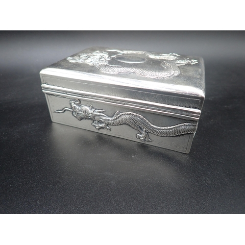 46 - A Chinese silver Cigarette Box with relief dragon design to lid and sides, 5 and 3½in, maker: Tuck C... 