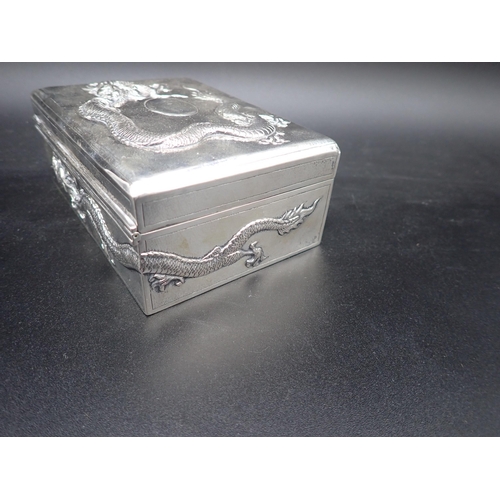 46 - A Chinese silver Cigarette Box with relief dragon design to lid and sides, 5 and 3½in, maker: Tuck C... 