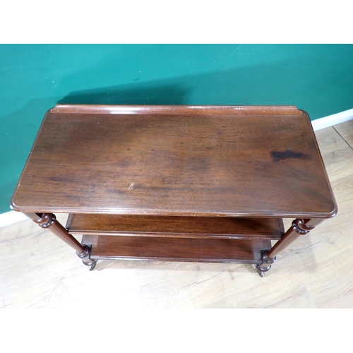 465 - A 19th Century mahogany small three tier Buffet with moulded shelves on turned tapering supports and... 