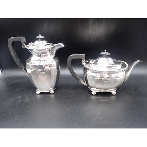 50 - An Edward VIII silver four piece Tea Service of panelled rectangular form raised on ball feet, engra... 