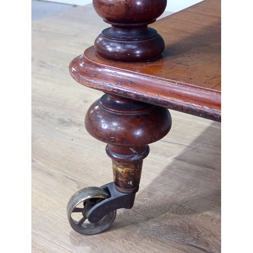 476 - A Victorian walnut three tier Buffet on turned supports and brass casters 3ft 7in H x 2ft 9in W