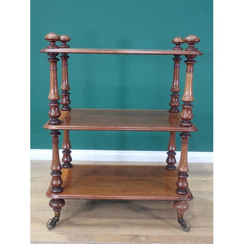 476 - A Victorian walnut three tier Buffet on turned supports and brass casters 3ft 7in H x 2ft 9in W