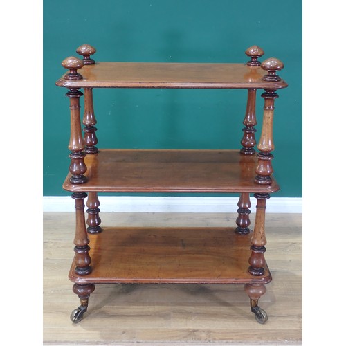 476 - A Victorian walnut three tier Buffet on turned supports and brass casters 3ft 7in H x 2ft 9in W