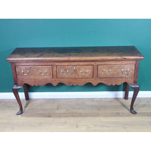 520 - An 18th Century oak Dresser Base with thick moulded top fitted three frieze drawers above shaped apr... 