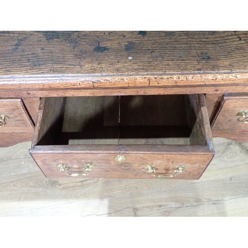 520 - An 18th Century oak Dresser Base with thick moulded top fitted three frieze drawers above shaped apr... 