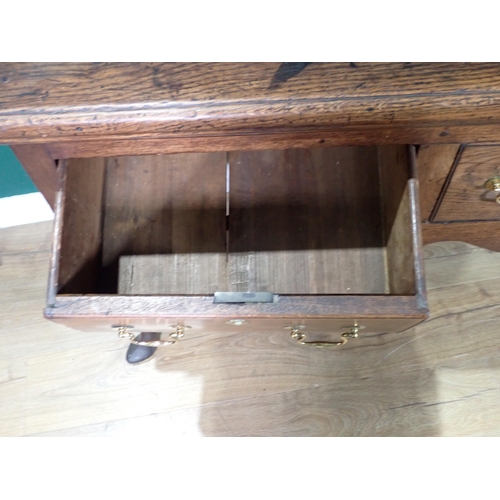 520 - An 18th Century oak Dresser Base with thick moulded top fitted three frieze drawers above shaped apr... 