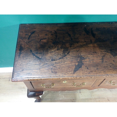 520 - An 18th Century oak Dresser Base with thick moulded top fitted three frieze drawers above shaped apr... 