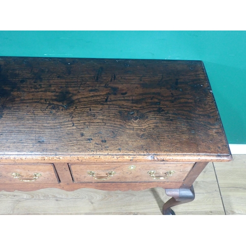 520 - An 18th Century oak Dresser Base with thick moulded top fitted three frieze drawers above shaped apr... 