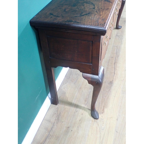 520 - An 18th Century oak Dresser Base with thick moulded top fitted three frieze drawers above shaped apr... 