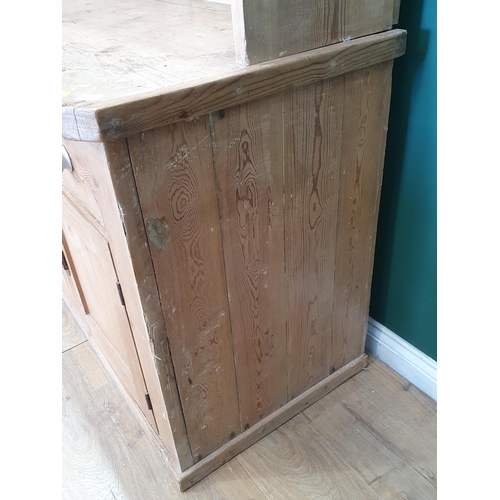 527 - A large 19th Century pine Dresser, the enclosed base with thick top above four drawers and four pane... 