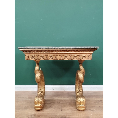 530 - An early 19th Century giltwood Console Table with green marble top, mounted upon carved dolphin supp... 