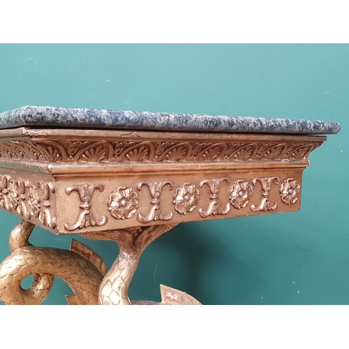 530 - An early 19th Century giltwood Console Table with green marble top, mounted upon carved dolphin supp... 