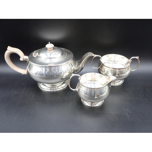 63 - A George V silver three piece circular Tea Service, London 1931, 900gms all in