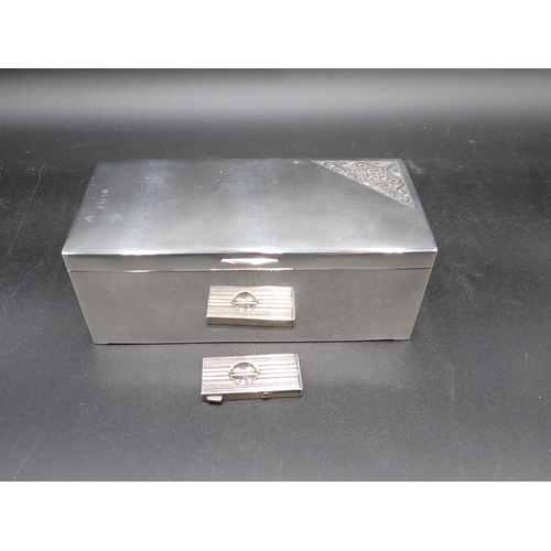 64 - A silver Cigar Box with scroll engraved corner, marks worn, and a Cigar Cutter