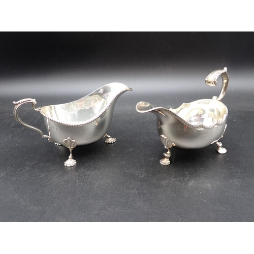 68 - A George VI silver Sauce Boat with gadroon rim on ornate feet, Birmingham 1949, and another, similar... 