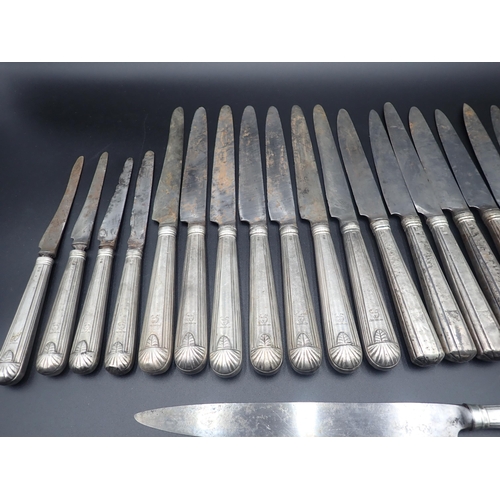 73 - A quantity of Georgian silver handled Knives, having steel blades, engraved crests, two Carving Fork... 