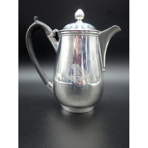 74 - A George III silver baluster Hot Water Jug, engraved crest, the hinged cover with bud finial, ebonis... 