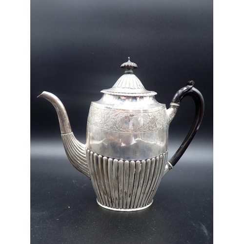 87 - A Victorian silver Coffee Pot of oval semi-fluted form with floral engraved frieze, London 1886, mak... 