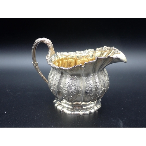 88 - A fine 19th Century silver matched three piece Tea Service of melon shape with finely chased and eng... 