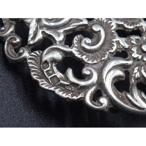 9 - A Victorian silver two part Nurse's Buckle with pierced floral and scroll design, Birmingham 1900, m... 