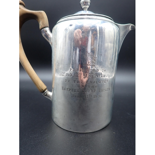 96 - A George III silver Hot Water Jug, engraved crest and presentation inscription, the cover with turne... 