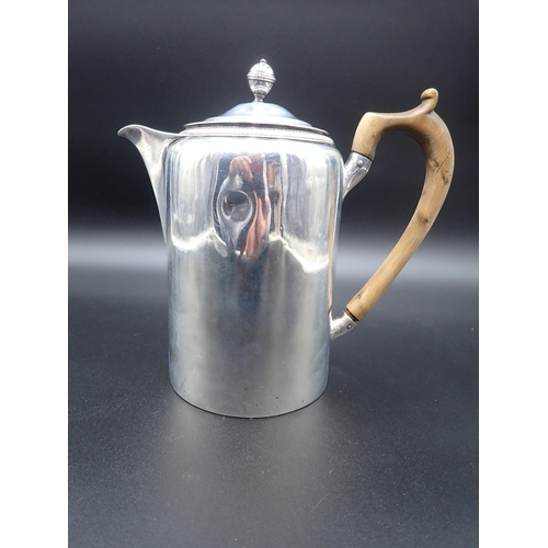 96 - A George III silver Hot Water Jug, engraved crest and presentation inscription, the cover with turne... 