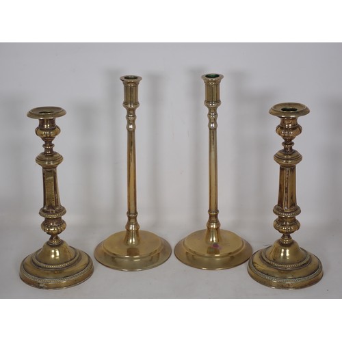 346 - A tall pair of brass Candlesticks on fine straight stems and circular bases in the 18th Century styl... 