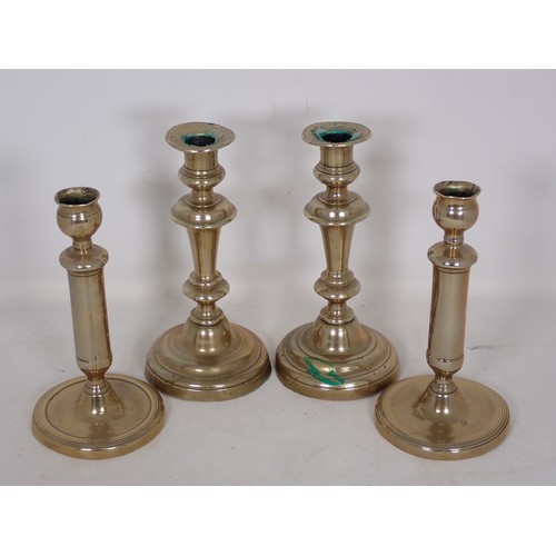 346 - A tall pair of brass Candlesticks on fine straight stems and circular bases in the 18th Century styl... 