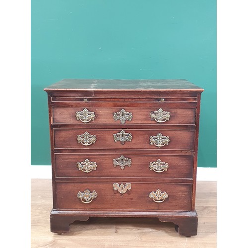 535 - An 18th Century mahogany Chest of Drawers, the moulded top above a brushing slide and four long draw... 