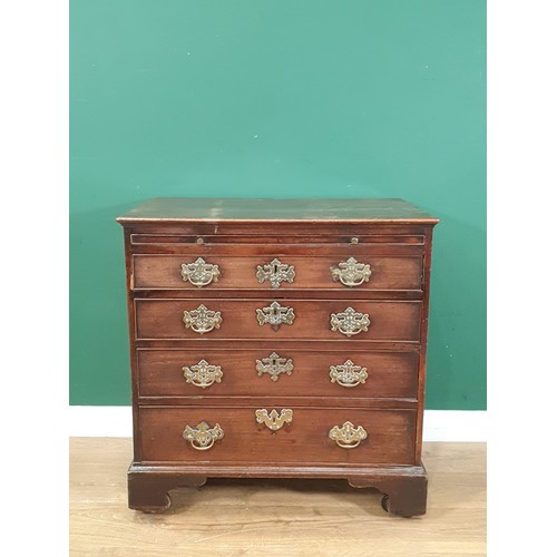 535 - An 18th Century mahogany Chest of Drawers, the moulded top above a brushing slide and four long draw... 