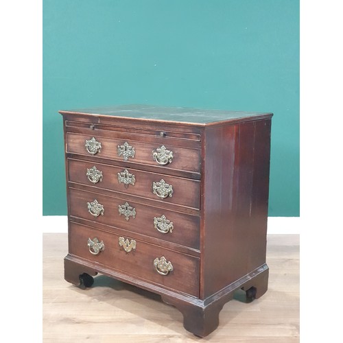 535 - An 18th Century mahogany Chest of Drawers, the moulded top above a brushing slide and four long draw... 