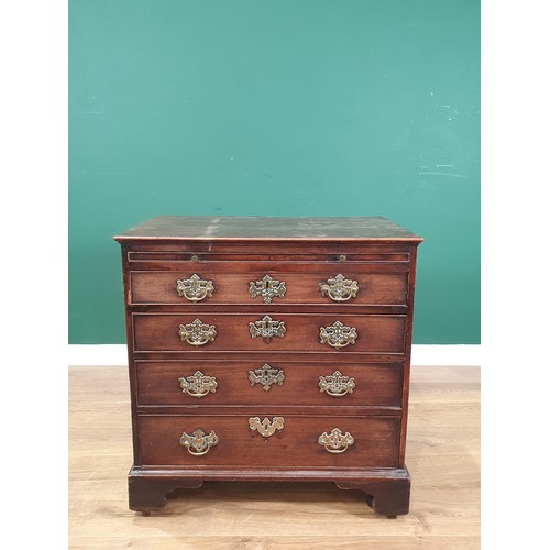 535 - An 18th Century mahogany Chest of Drawers, the moulded top above a brushing slide and four long draw... 