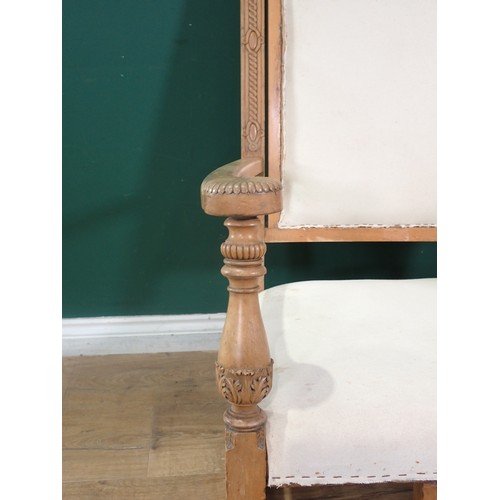 479 - A 19th Century beechwood open Rocking Chair with carved mask finials above acanthus leaf detail, the... 