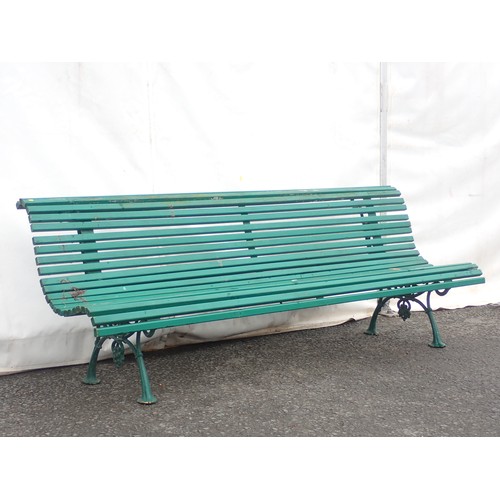 385 - A green painted Garden Bench with wooden slats on cast iron leafage and scroll supports 6ft 9in W x ... 