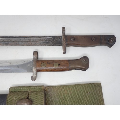 1265 - An 1888 Pattern Bayonet dated 1897 on scabbard and ricasso complete in a webbing frog, another simil... 