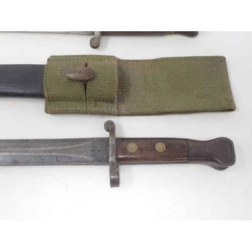 1265 - An 1888 Pattern Bayonet dated 1897 on scabbard and ricasso complete in a webbing frog, another simil... 