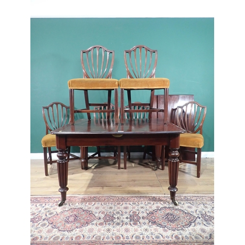 462 - A Victorian mahogany extending Dining Table with pull out action, and three spare leaves mounted upo... 