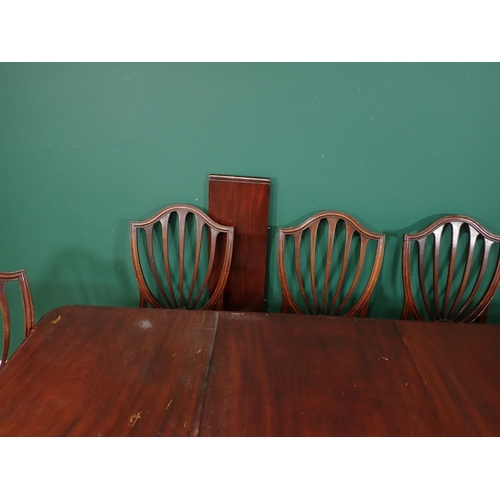 462 - A Victorian mahogany extending Dining Table with pull out action, and three spare leaves mounted upo... 