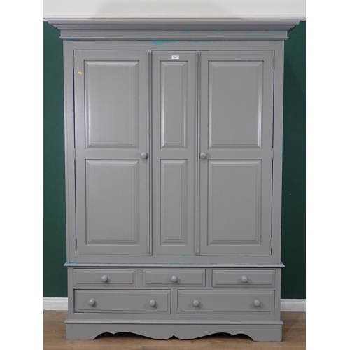 465 - A modern painted pine Wardrobe, the top section with pair of panelled doors, above the base fitted t... 