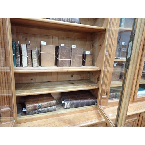 534 - A large French oak Bookcase, the upper section fitted four glazed doors enclosing adjustable shelves... 